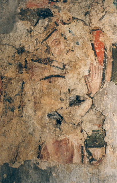 De figuur links van Christus.
