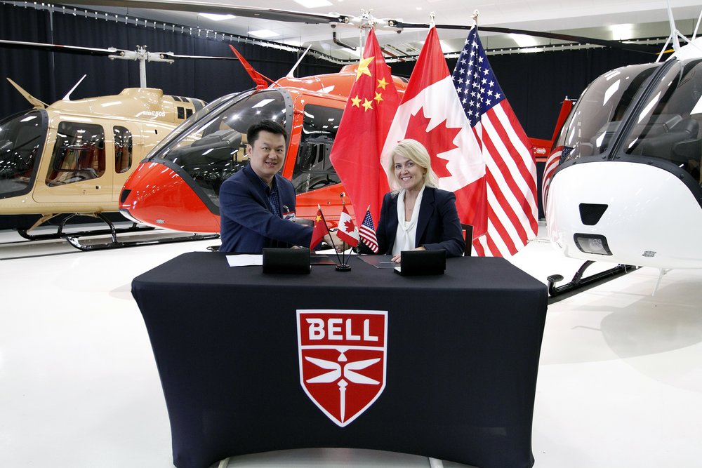 George Geng, President of Reignwood Zhuhai and Cynthia Garneau, President of Bell Canada.jpg