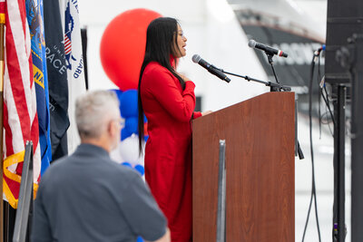 Sukie Ricker sings National Anthem.jpg