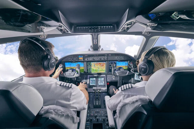 Pilots in a Cessna Citation Ascend cockpit.