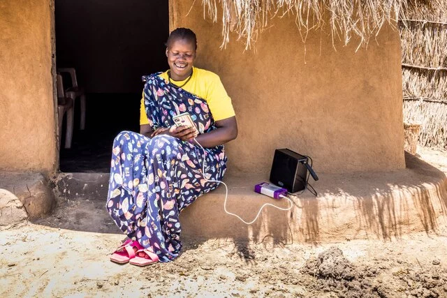 Off-grid solar battery powering phone by POPO, GOGLA