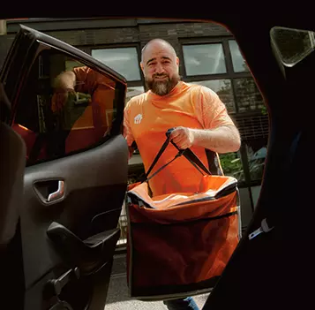 Courier_sRGB_All_2026_40-55_Male_Putting-Bag-Inside-Car_357x351