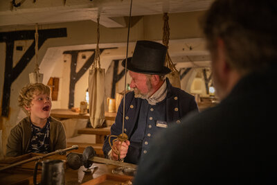 Sword is showcased by a member of the team - Credit NMRN