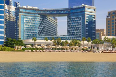 NH Collection Dubai The Palm Hotel_Facilties Swimming Pool Exterior with Beach Club.jpg