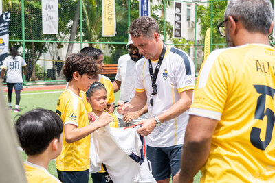 Avani+ Fares Maldives Resort_Football Camp 2025_Michael Owen_Jersey Signing_Kids.jpg