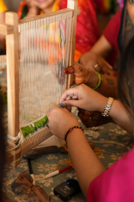 Guests Learning Weaving from a Jaipur Rugs Artisan.png