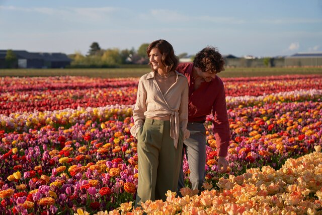 Anantara_Grand_Hotel_Krasnapolsky_Amsterdam_Lifestyle_Couple_Walking_Tulip_Fields_Smiling.jpg