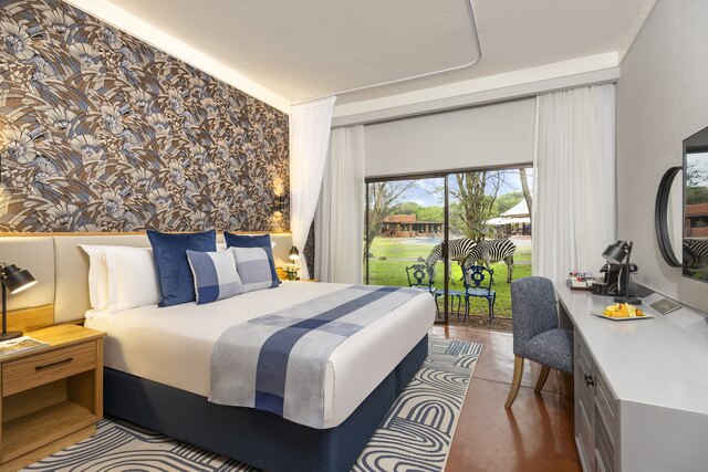 Avani_Victoria_Falls_Resort_Avani_Superior_Room_Bedroom_Pool_Facing.JPG