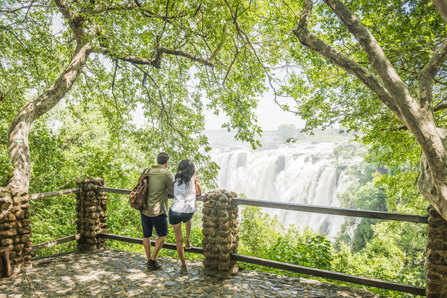 Avani_Victoria_Falls_Resort_Recreation_Facility_Victoria_Falls_Couple_At_Lookout_Point_Looking_At_The_Victoria_Falls.jpg