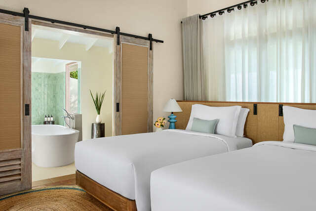 Twin Bedroom of the Two-Bedroom Reethi Suite at NH Collection Maldives Reethi Resort.jpg