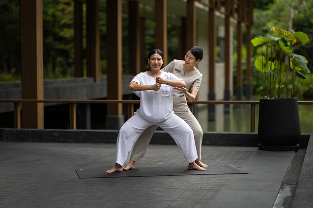 Khun Earnt of Layan Life Guiding a Guest Through Movement.jpg