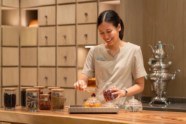 Khun Earnt of Layan Life Preparing Thai Traditional Medicine for Guest.jpg