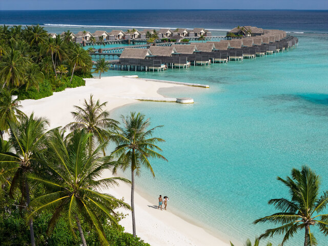 Niyama Private Islands Maldives_Restaurant Aerial View Couple Beach Walk.JPG