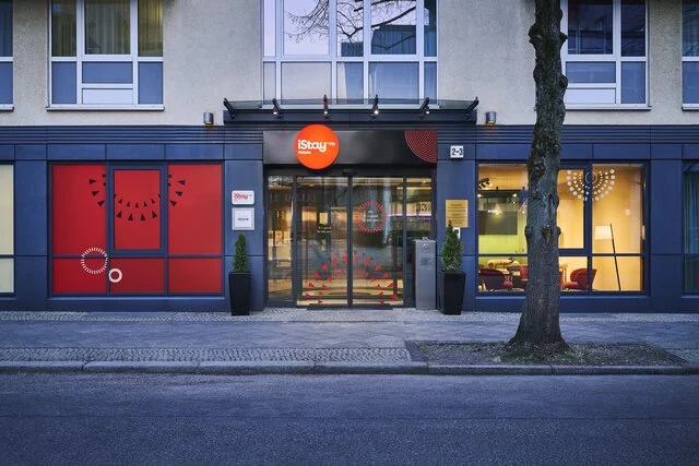 iStay_by_NH_Berlin_City_Ost_facade_night_entrance