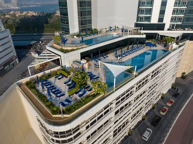 Avani_Plus_Palm_View_Dubai_Hotel_and_Suites_Exterior_View_Aerial_Pool_View_Day_Time_Dubai