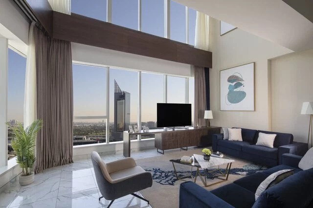 Avani_Plus_Palm_View_Dubai_Hotel_and_Suites_Guest_Room_Superior_Duplex_Apartment_City_View_Living_Room