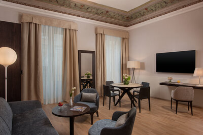 NH_Collection_Palazzo_Sitano_Room_Suite_Affresco_Living_Area_Couch_Table_Chairs_TV-3467x2307.jpg