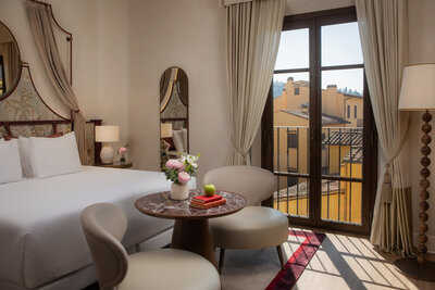 NH_Collection_Porta_Rossa_Room_Premium_508_Bed_View_Curtains_Open_Table_Chairs