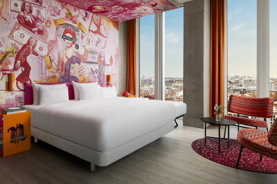 nhow_Frankfurt_Room_Junior_Suite_extra_bed_armchairs_table