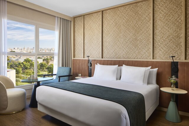 NH_Valencia_Center_Room_junior_suite_King_size_window_natural light_exterior.jpg