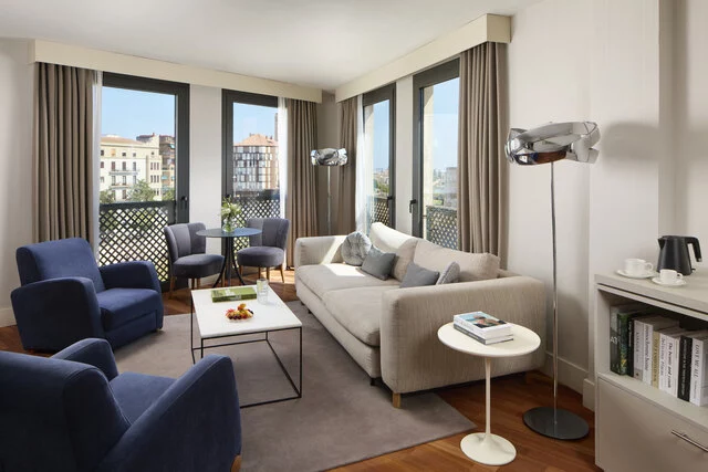 NH_Malaga_Room_junior_suite_curtains_open_comfy_sitting_living room