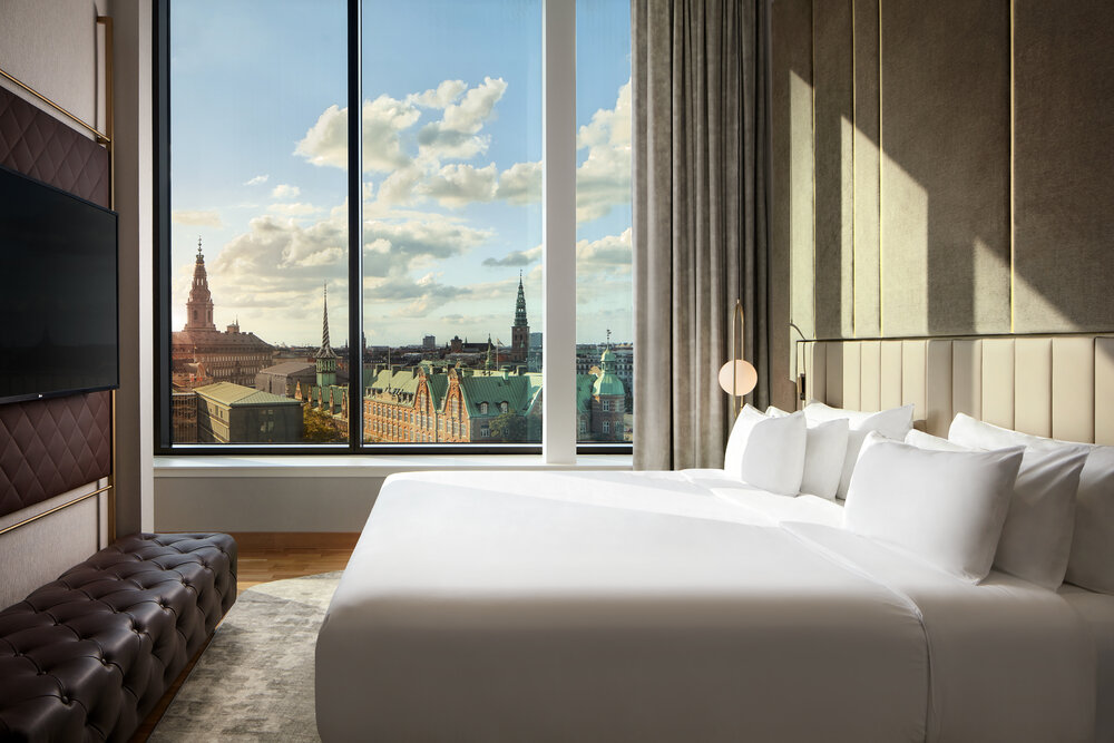 NH_Collection_Copenhagen_Room_Presidential_Suite_Bedroom_sunset.jpg