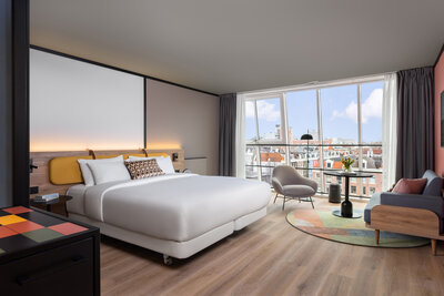 Avani_Museum_Quarter_Amsterdam_Hotel_Rooms_Superior_Room_Panoramic_Canal_View_Queen_Bed_Air_Purifier_Siting_Area