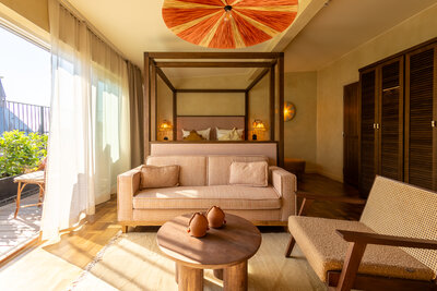 NH_Collection_Copenhagen_Grand_Joanne_Room_bed_sofa_terrace.jpg