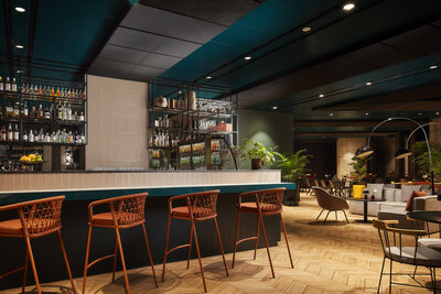 NH_Collection_Frankfurt_Spin_Tower_Bar_Oaks_interior_counter_orange_bar_chairs