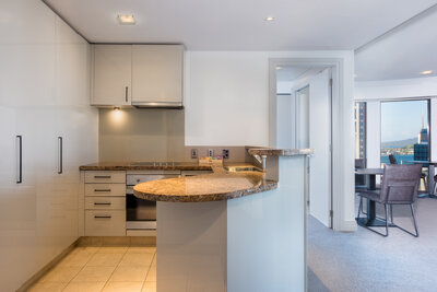 Avani_Metropolis_Auckland_Residences_Guest_Room_Two_Bedroom_Suite_Kitchen_Door_Cabinet_Counter