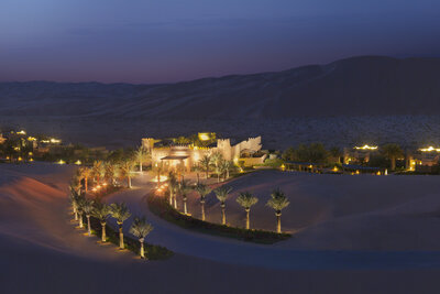 Qasr_Al_Sarab_Desert_Resort_by_Anantara_Exterior_View_Pathway_Twilight-8854x5910