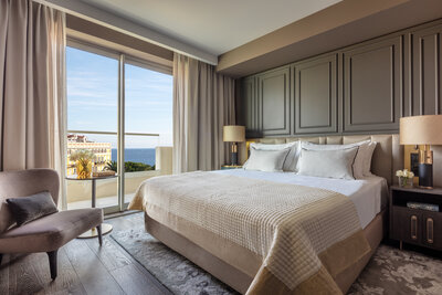 Anantara_Plaza_Nice_Deluxe_Sea_Garden_View_Balcony_Bed_Hero_v20097-3-2