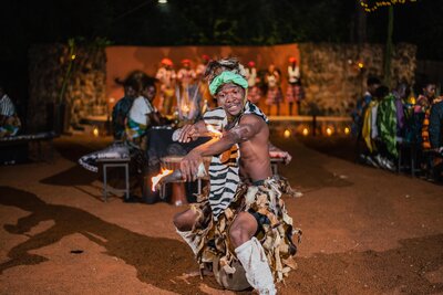 617317-Avani Victoria Falls Resort_Boma Dinner_Fire Performer-be1fe2-original-1760079279.jpg
