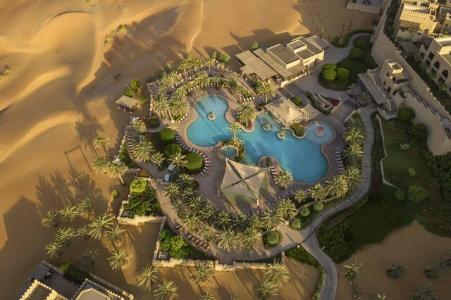 Qasr_Al_Sarab_Desert_Resort_By_Anantara_Property_Amenity_Swimming_Pool_Aerial_View-7087x4721