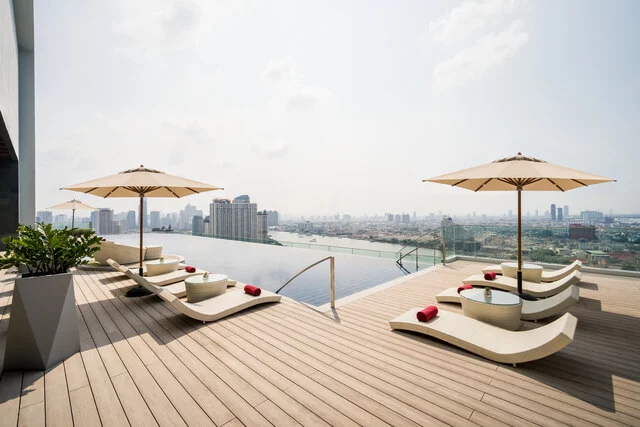 Avani_Plus_Riverside_Bangkok_Hotel_Pool_view_Swimming_Pool_Deck_with_Loungers