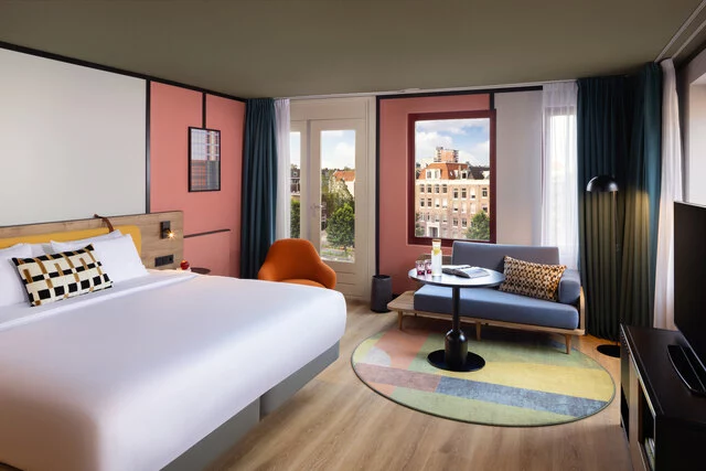 Avani_Museum_Quarter_Amsterdam_Hotel_Rooms_Deluxe_Room_Canal_View_Queen_Bed_Air_Purifier_Siting_Area