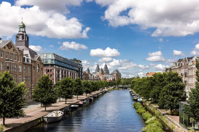 Avani_Museum_Quarter_Amsterdam_Hotel_Facade_Canal_Clouds_Summer_Green_Trees_Daytime