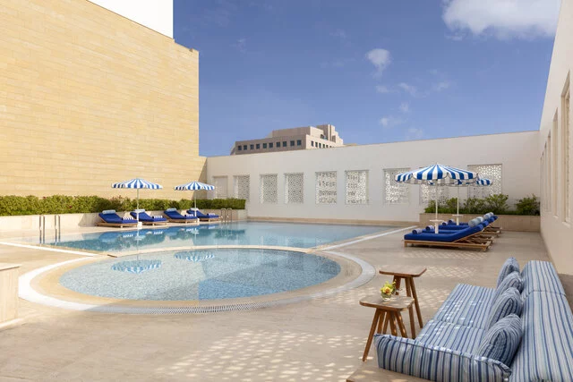 Al_Najada_Doha_Hotel_By_Tivoli_Pool_View_Pool_Courtyard_with_Loungers_and_Sofa