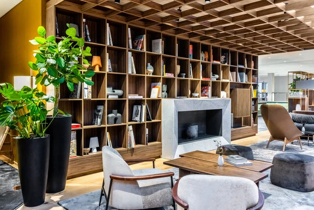 NH_Collection_Copenhagen_Lobby_and_reception_lounge_area_with_grey_chairs_and_tables-8192x5464