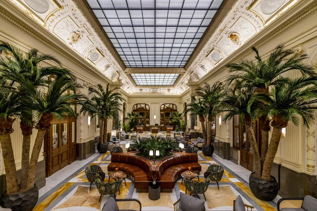 NH_Collection_Prague_Carlo_IV_Lobby_and_reception_empty_overview_palm_trees_night-8192x5464