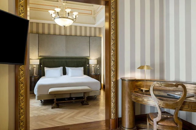 NH_Collection_Prague_Carlo_IV_room_suite_living_room_view_desk_king_size_bed_TV-8167x5447