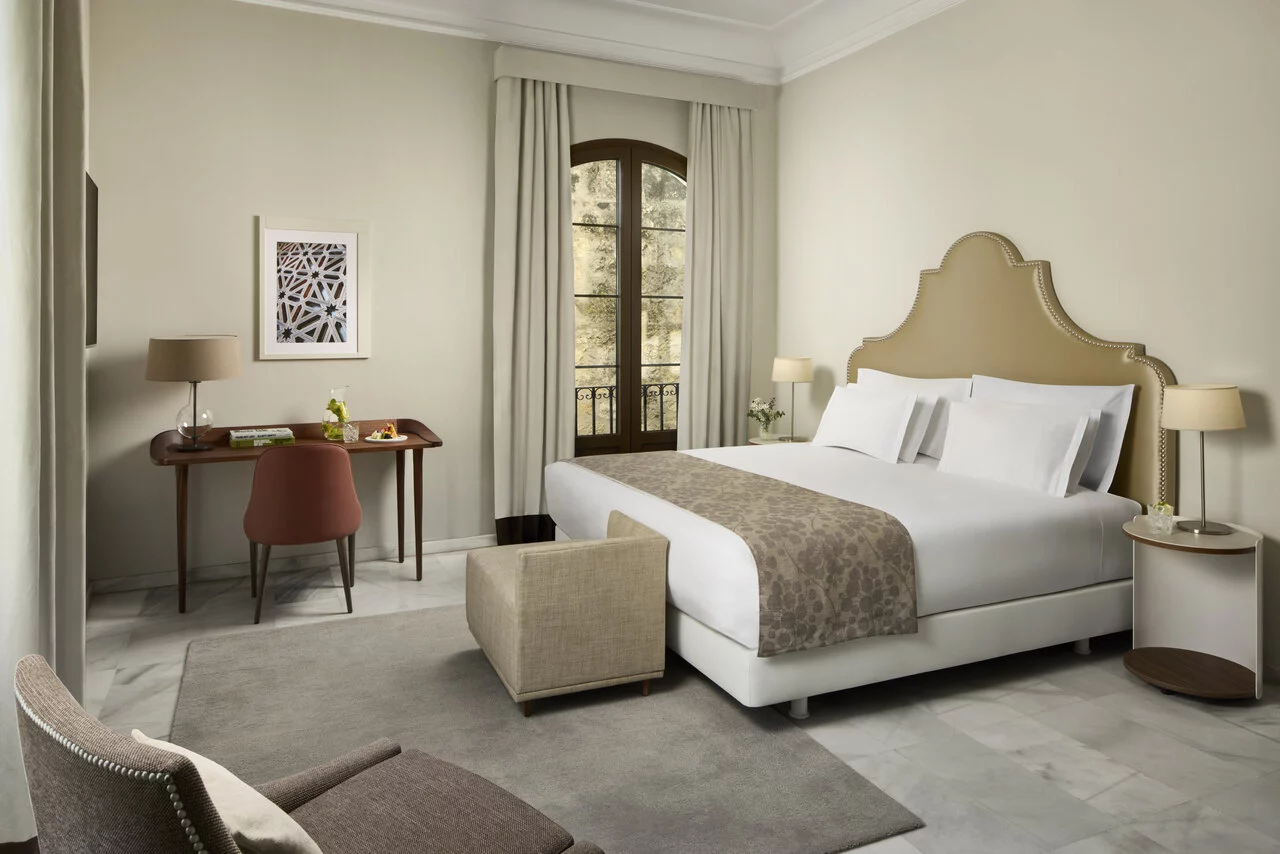 NH_Collection_Palacio_De_Cordoba_Room_Junior_Suite_Curtains_Open_Queen_Size_Bed.jpg