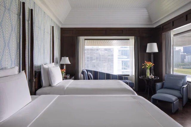 Anantara_Siam_Bangkok_Hotel_Guest_Room_Two_Bedroom_Jim_Thompson_Explorer_Suite_Twin_Bedroom_With_Golf_Course_And_City_View