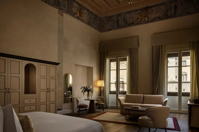 Porta_Rossa_Hotel_Firenze_Colbert_Collection_Amici_Miei_Junior_Suite_with_FrescoesΓÇï_Living_Room_Sofa_Wide_Shot_Window_Views