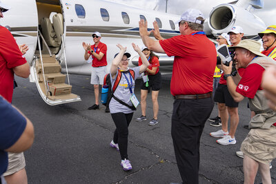 Special Olympics Airlift_Ron with athlete high-five