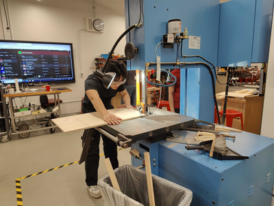 Zhi Han (Anthony) Yao cutting a template for Kiriboard.