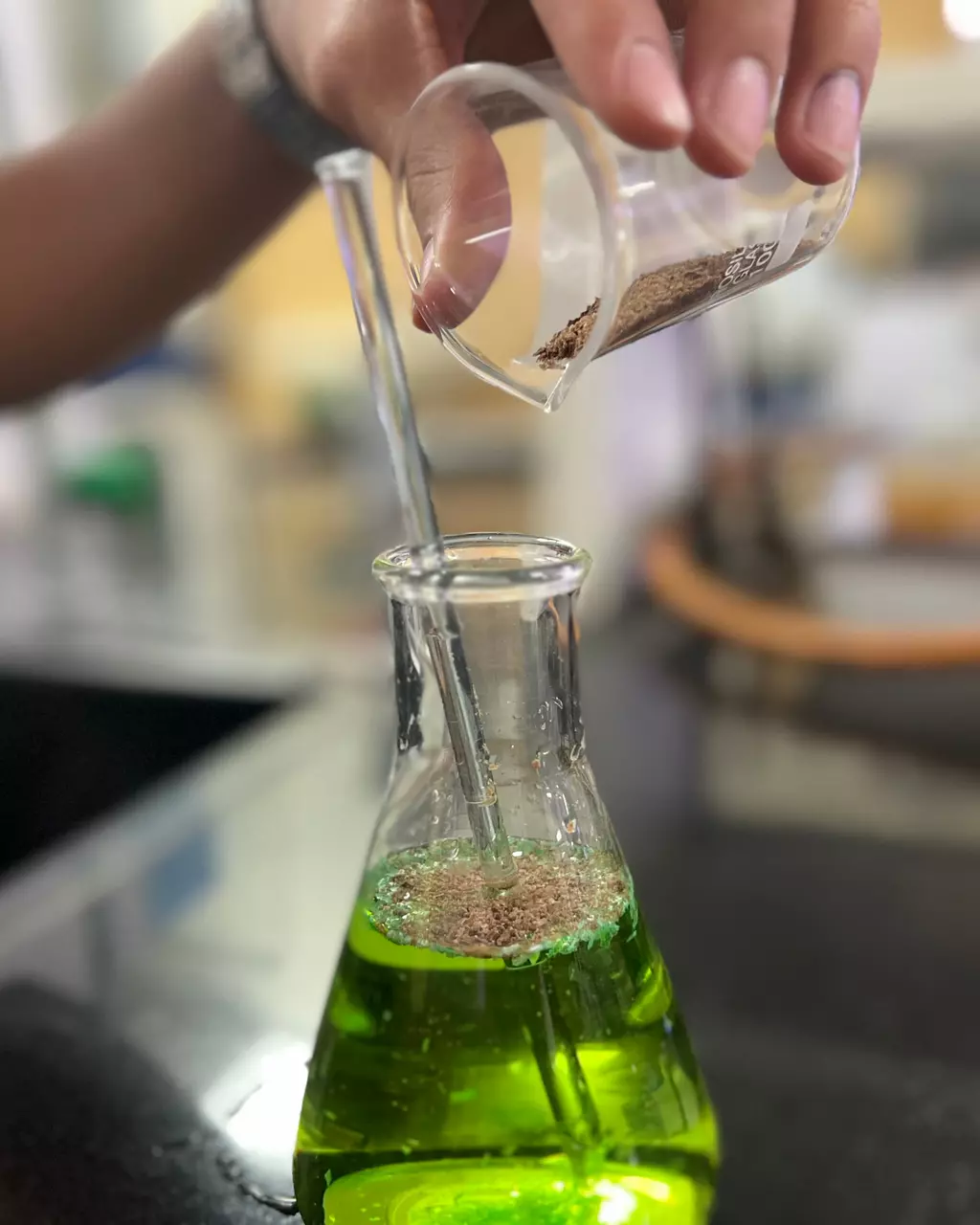 Demonstration - Adding the tamarind-based powder to water (dyed green for visibility)