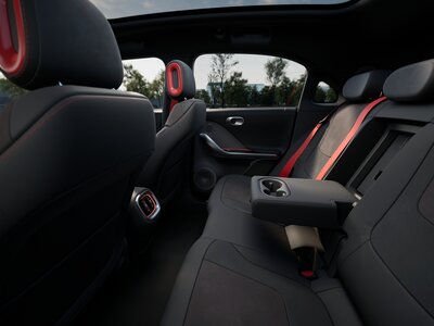 eu-brabus-atomgreymatt-radiantred-int-012-rearlegroomopenconsole-urban