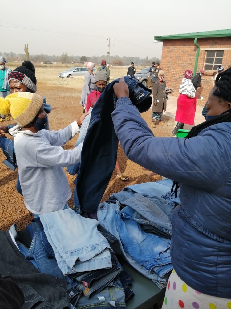 Community receiving pre-loved denims from Vaal Mall.jpg