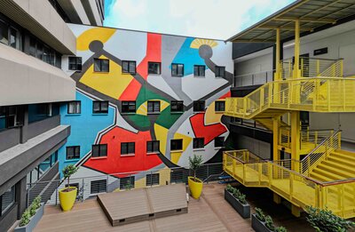 Mural for Thrive Student Living's Arteria Parktown entitled Ukuzilanda Ukuzilandela Nokuzelapha.jpg